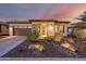 Single-story home with desert landscaping and a two-car garage at 13162 W Duane Ln, Peoria, AZ 85383