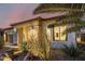 View of the home's exterior, showcasing stone accents and landscaping at 13162 W Duane Ln, Peoria, AZ 85383