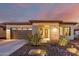 Single story home with a two-car garage and drought-tolerant landscaping at 13162 W Duane Ln, Peoria, AZ 85383