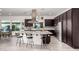 Modern kitchen with island, stainless steel appliances, and dark cabinetry at 13162 W Duane Ln, Peoria, AZ 85383