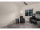 Home office with desk, chair, and ample natural light at 13162 W Duane Ln, Peoria, AZ 85383