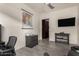 Home office with desk, chair, and ample natural light at 13162 W Duane Ln, Peoria, AZ 85383
