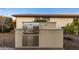 Built-in outdoor kitchen with stainless steel grill and ample counter space at 13162 W Duane Ln, Peoria, AZ 85383