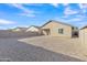 Backyard view of house with gravel and block wall at 13283 E Lupine Ln, Florence, AZ 85132