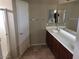 Bathroom with double sinks, shower, and tile floor at 14737 N 174Th Dr, Surprise, AZ 85388