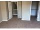 Upstairs bedroom with carpet and walk-in closet at 14737 N 174Th Dr, Surprise, AZ 85388