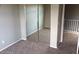 Bedroom with mirrored closet doors and carpet at 14737 N 174Th Dr, Surprise, AZ 85388