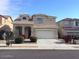 Two-story house with attached garage and landscaping at 14737 N 174Th Dr, Surprise, AZ 85388