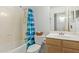 Clean bathroom with shower/tub combo and wood vanity at 15306 W Eureka Trl, Surprise, AZ 85374