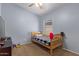 Cozy bedroom with twin bed and carpet flooring at 15306 W Eureka Trl, Surprise, AZ 85374