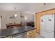 Spacious kitchen with island, stainless steel appliances, and breakfast bar at 15306 W Eureka Trl, Surprise, AZ 85374