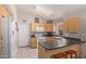 Efficient kitchen with ample cabinetry and modern appliances at 15306 W Eureka Trl, Surprise, AZ 85374