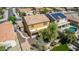 Backyard with pool, patio, and mature tree at 16109 W Christy Dr, Surprise, AZ 85379