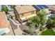 Backyard with artificial turf, walkway, and mature tree at 16109 W Christy Dr, Surprise, AZ 85379