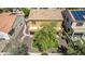 Backyard with artificial turf, walkway, and mature tree at 16109 W Christy Dr, Surprise, AZ 85379