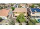 Backyard with pool, patio, and mature tree at 16109 W Christy Dr, Surprise, AZ 85379