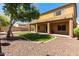 Large backyard with covered patio and artificial turf at 16109 W Christy Dr, Surprise, AZ 85379