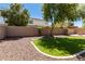 Landscaped backyard with artificial turf and trees at 16109 W Christy Dr, Surprise, AZ 85379
