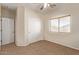 Well-lit bedroom with double door closet and carpet floor at 16109 W Christy Dr, Surprise, AZ 85379