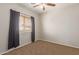 Bedroom with window, carpet flooring, and neutral wall color at 16109 W Christy Dr, Surprise, AZ 85379