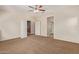 Bright bedroom with carpet flooring and double door access at 16109 W Christy Dr, Surprise, AZ 85379