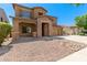 Two-story home with stone accents and a landscaped yard at 16109 W Christy Dr, Surprise, AZ 85379