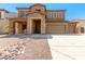 Two-story home with stone accents and a landscaped yard at 16109 W Christy Dr, Surprise, AZ 85379