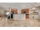 Open kitchen boasts a large island, modern finishes and views to living area at 16109 W Christy Dr, Surprise, AZ 85379