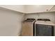 Well-lit laundry room with modern washer and dryer at 16109 W Christy Dr, Surprise, AZ 85379