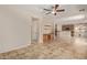 Open living room with tile flooring and built-in shelving at 16109 W Christy Dr, Surprise, AZ 85379