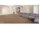 Spacious living room with large windows and neutral carpeting at 16109 W Christy Dr, Surprise, AZ 85379