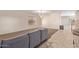 Spacious living room with neutral carpeting and staircase at 16109 W Christy Dr, Surprise, AZ 85379