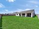Backyard with lush green lawn and a block wall at 17815 W Denton Ave, Litchfield Park, AZ 85340
