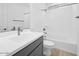 Bright bathroom featuring a tub and gray vanity at 17815 W Denton Ave, Litchfield Park, AZ 85340