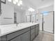 Elegant bathroom with double vanity and glass-enclosed shower at 17815 W Denton Ave, Litchfield Park, AZ 85340
