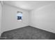 Neutral bedroom with plush carpet and a bright window at 17815 W Denton Ave, Litchfield Park, AZ 85340