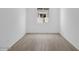 Bedroom featuring wood-look tile floors and one window at 17815 W Denton Ave, Litchfield Park, AZ 85340