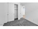 This bedroom has plush carpeting and a closet with sliding doors at 17815 W Denton Ave, Litchfield Park, AZ 85340