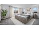 Spacious bedroom with neutral tones, a large bed, and ample natural light creating a relaxing atmosphere at 17815 W Denton Ave, Litchfield Park, AZ 85340