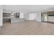 Open floor plan: Kitchen flows into the living space with a sliding glass door at 17815 W Denton Ave, Litchfield Park, AZ 85340