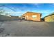 Large backyard with gravel and a small patio at 19945 W Badgett Ln, Litchfield Park, AZ 85340