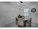 Bright dining room with a round wooden table and four chairs at 19945 W Badgett Ln, Litchfield Park, AZ 85340