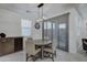 Dining room features a round table, chairs, and sliding glass doors at 19945 W Badgett Ln, Litchfield Park, AZ 85340