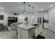 Open concept kitchen with island and stainless steel appliances at 19945 W Badgett Ln, Litchfield Park, AZ 85340