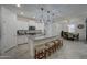 Modern kitchen with island and white cabinetry at 19945 W Badgett Ln, Litchfield Park, AZ 85340