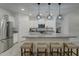 Modern kitchen with granite countertops and stainless steel appliances at 19945 W Badgett Ln, Litchfield Park, AZ 85340
