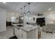 Open concept kitchen with large island and granite countertops at 19945 W Badgett Ln, Litchfield Park, AZ 85340