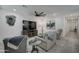 Living area with large TV and comfortable furniture at 19945 W Badgett Ln, Litchfield Park, AZ 85340