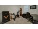 Home office with Peloton bike, clock, and work area at 19945 W Badgett Ln, Litchfield Park, AZ 85340