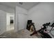 Home office with Peloton bike and game area at 19945 W Badgett Ln, Litchfield Park, AZ 85340
